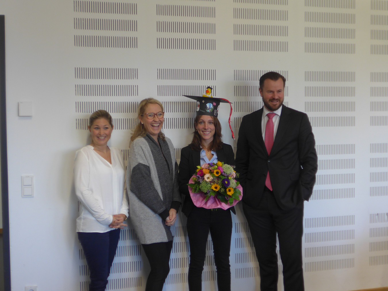 Photo of doctor Daniela Claus immediately after her doctoral lecture