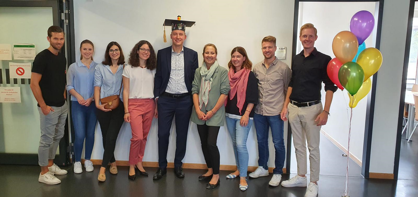 Photo of doctor Alexander Nolte and the IRWP-team immediately after his doctoral lecture